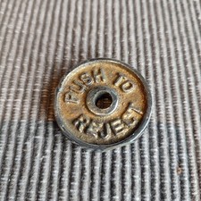 Push to Reject from old Vintage coin operated Arcade machine Nominator