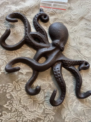 Cast iron swimming octopus - cast,