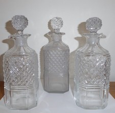 THREE  GEORGE 111 CUT GLASS DECANTERS 1806  FROM A SILVER DECANTER STAND