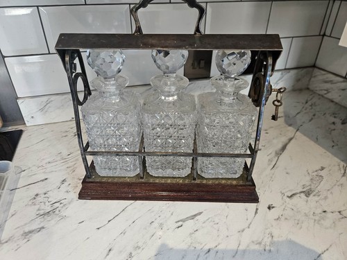 Antique tantalus decanter set - ,