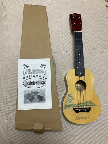 Ukulele with manual and - with,