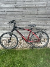 Trek 4500 series black and red mountain bike. 27 gears with rear pannier rack.