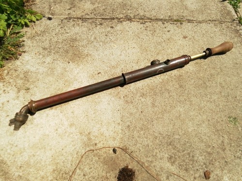 Antique hand pump brass
