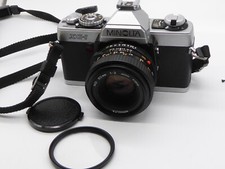 Minolta XG 1 camera Minolta MD 50mm f2 lens + filter + cap&strap working