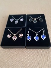4 SETS NECKLACE AND EARRINGS. GIFT BOXED. NEW. JOBLOT