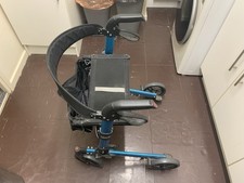 Folding walking aid with seat