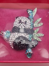 Vintage signed BUTLER & WILSON panda clinging to bamboo with a bird on his back