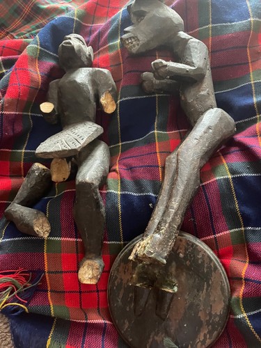Wooden carved figures damaged