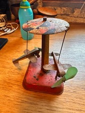 TINPLATE clockwork  roundabout and two boats