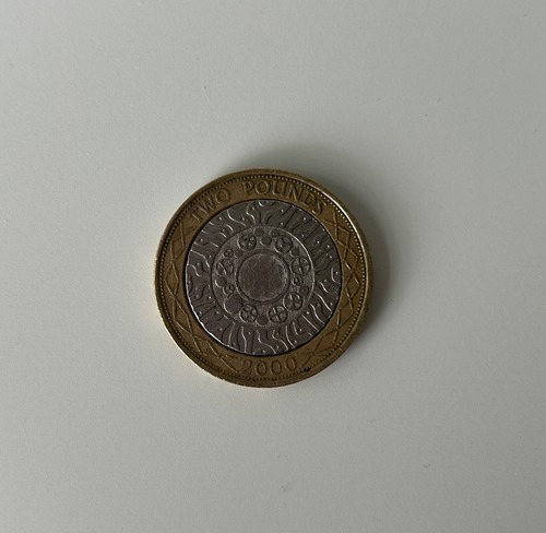 Coin standing on the - £2,