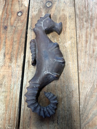 Hand carved mahogany seahorse - hand,