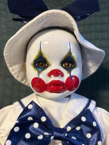 Sitting porcelain doll clown