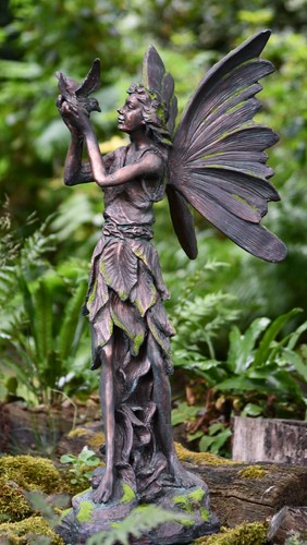 Fairy with bird mossy garden - with,