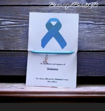 In awareness and support of diabetes wish bracelet blue ribbon charm corded