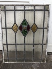 Vintage leaded stained glass window. Diamond design.
