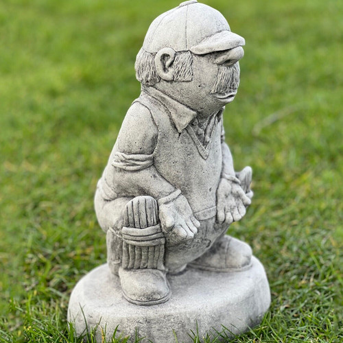 Concrete cricket player statue