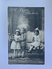 A Happy Birthday Postcard 1926 Three Children Flowers Toys posted to Cleethorpes