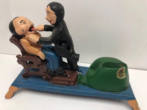Vintage cast iron the dentist - the,
