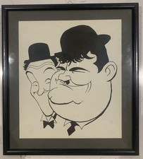 Glass framed caricature print of Laurel and Hardy