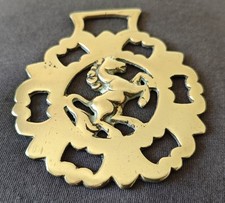 ANTIQUE CAST HORSE BRASS - REARING HORSE FACING RIGHT IN LARGE 'BAT WING' FRAME