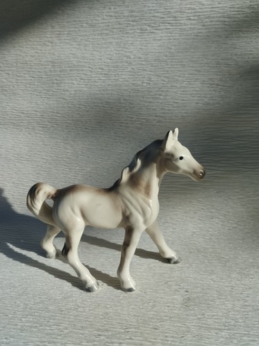 White ceramic horse figurine - white,