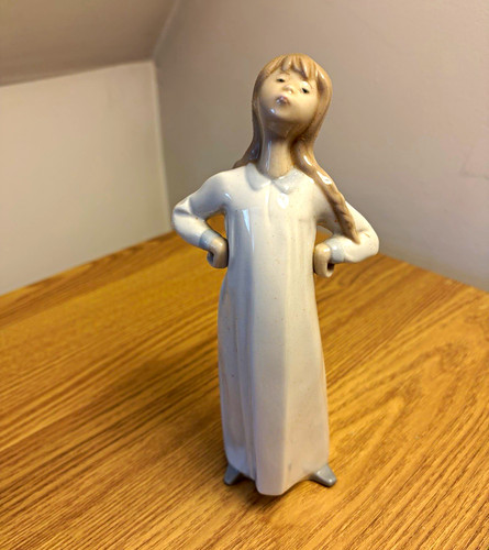 Lladro girl stretching - “girl, stretching”