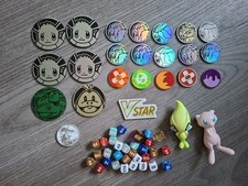 Joblot Of Pokemon coins, Dice And Other Collectables, Mew And Celebi Squashies.