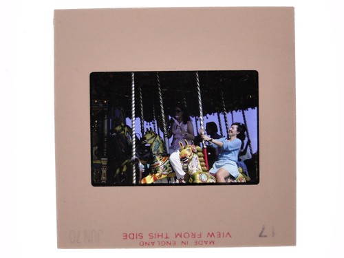 Women riding carousel - women,