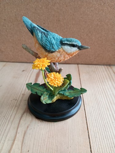 Nuthatch with dandelion - with,