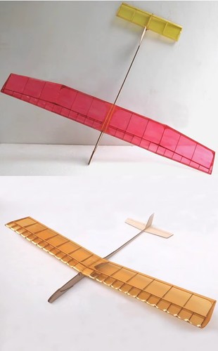 Two balsa wood hand held - two,