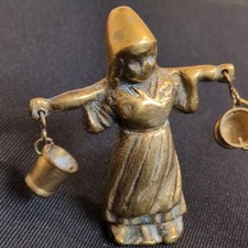 Antique Milk Maid Carrying Two Pails on a Yoke.  