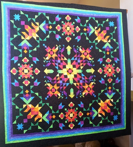 Hand made quilt with bright - hand,