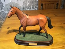 Royal Doulton Grand National Winner RED RUM Horse Figurine on a wooden plinth