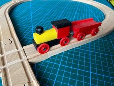 wooden train set with figure of 8 track with engine and trailer 