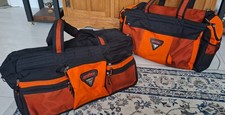 Antler luggage, orange and black holdalls