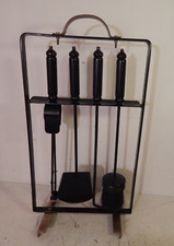 A retro metal and brass fire companion tool set