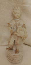 Vintage Ceramic Figurine of a Boy holding a spaniel - marble-like hollow ceramic