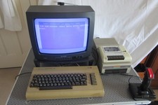 Commodore 64  with cassette deck, disk drive, manuals and software
