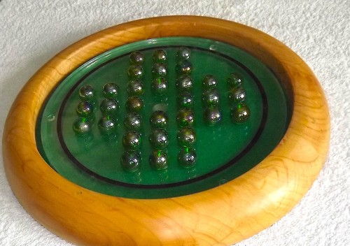 Wooden solitaire board game