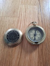 compass, featuring a lid with