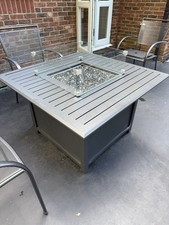 MODERN SQUARE GARDEN TABLE WITH GAS FIRE PIT & GLASS WIND GUARD IN VGC