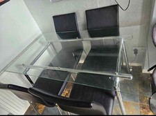 glass dining room table and Black Leather chairs