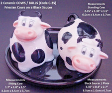 Ceramic cow figurines on - 2,