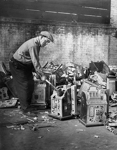 Police smashing slot machines - police,