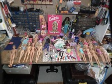 A LARGE COLLECTION OF BARBIE DOLLS 20 IN TOTAL  + CLOTHES HANDBAGS AND SUCH