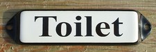 ENAMEL TOILET SIGN. BLACK TEXT