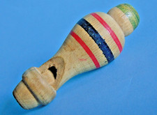 Small vintage working wooden turned whistle with red, blue, green decoration