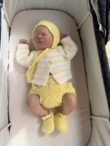 Hand knitted layette - hand,