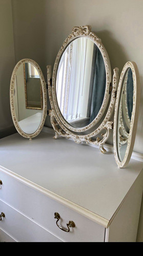 White ornate tri - white, tri-fold