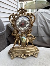 Mod Dep Cherub Clock  Regency